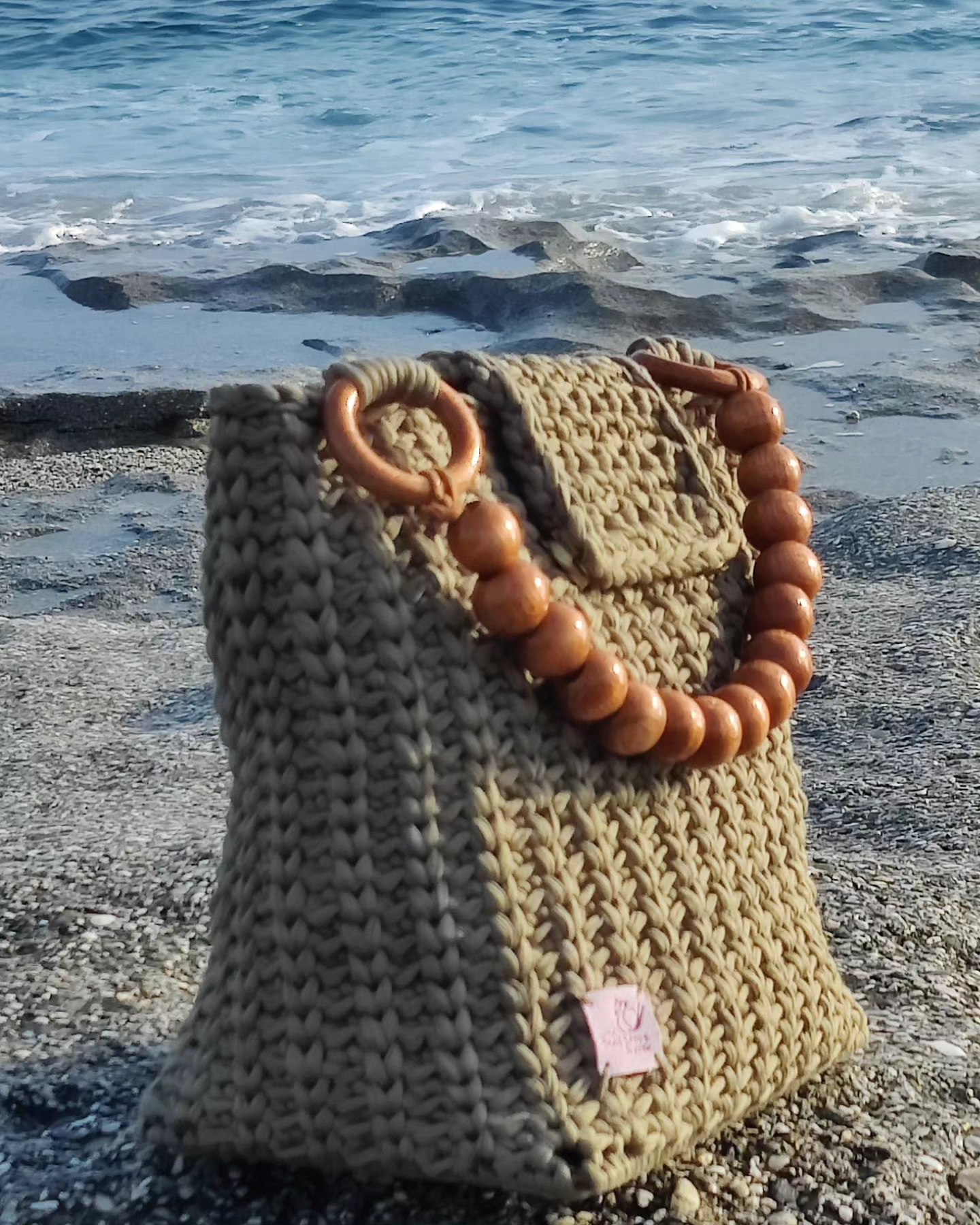 Olive crochet bag with wooden ball accent