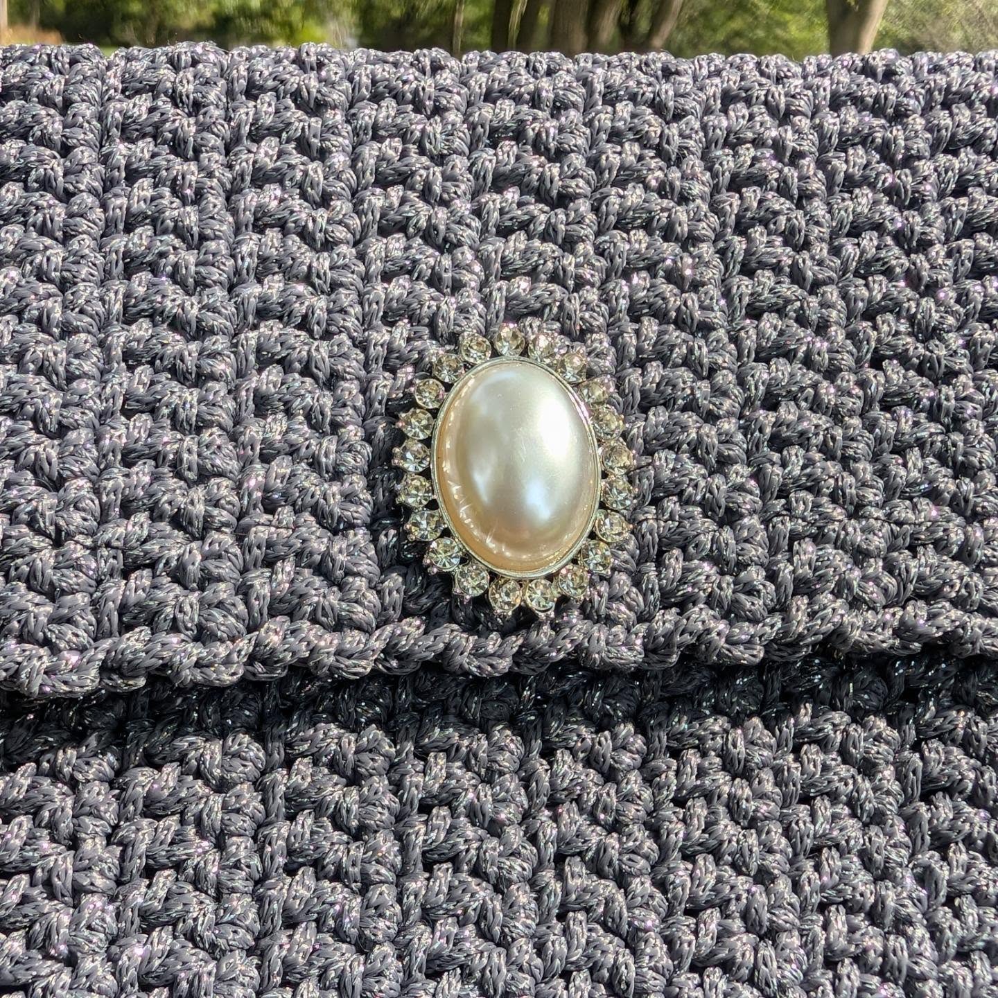 Artisanal detail of crochet clutch